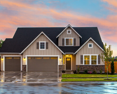 A house with wet pavement around it