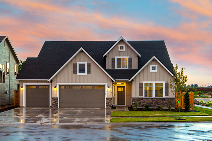 A house with wet pavement around it